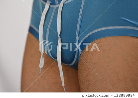 A man's bust after a breast augmentation session 128999984