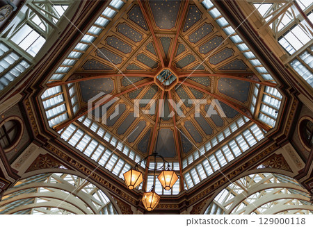 the ornate Victorian architecture of the ceiling and colorful decorations within Leadenhall Market. the ornate Victorian architecture of the ceiling and colorful decorations within Leadenhall Market. 129000118