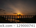 Sunset over the Sogogawa Bridge and a motorbike Sunset over the Sogogawa Bridge and a motorbike 129000741