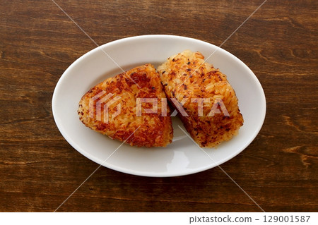 Handmade grilled rice balls on a table background viewed from directly above Handmade grilled rice balls on a table background viewed from directly above 129001587