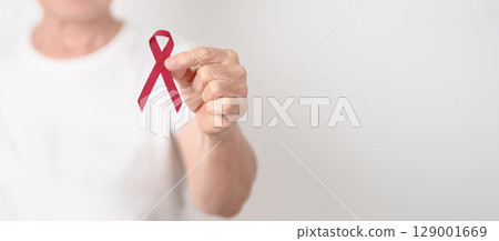 Elderly with Burgundy Ribbon for March Multiple Myeloma Cancer Awareness month, September Sickle Cell Anemia, Headache and Migraine week, April world Meningitis day, October Hospice  Palliative care 129001669