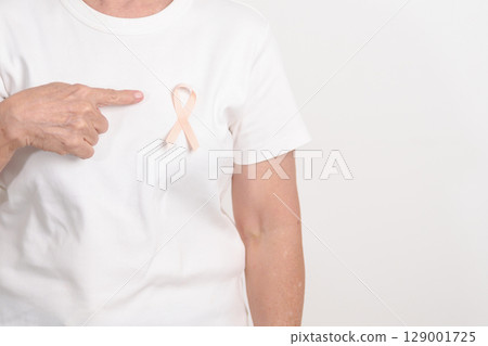 Elderly woman with Peach Ribbon for September Uterine Cancer Awareness month, Endometrial Cancer, Gynecologic, Uterus and Ovaries, Endometriosis, June Vaginal cancer and World cancer day concept Elderly woman with Peach Ribbon for September Uterine Cancer Awareness month, Endometrial Cancer, Gynecologic, Uterus and Ovaries, Endometriosis, June Vaginal cancer and World cancer day concept 129001725