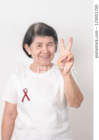 Elderly with Burgundy Ribbon for March Multiple Myeloma Cancer Awareness month, September Sickle Cell Anemia, Headache and Migraine week, April world Meningitis day, October Hospice Palliative care Elderly with Burgundy Ribbon for March Multiple Myeloma Cancer Awareness month, September Sickle Cell Anemia, Headache and Migraine week, April world Meningitis day, October Hospice Palliative care 129001780