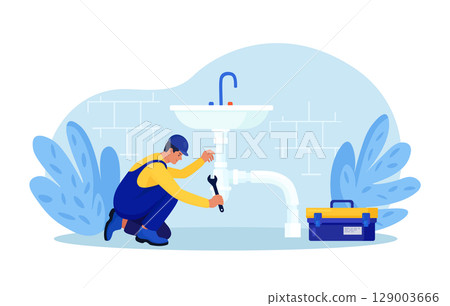 Repairman in uniform repairs ceramic sink, plumbing pipes with tool. Professional worker with wrench. Home masters, handyman fixing broken home plumbing. Electrician, plumber call. Repair service 129003666