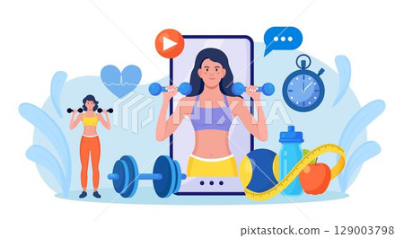 Online sport lesson and fitness course on phone screen. Sportive Woman Training at Home with sport equipment. Cardio, yoga and bodybuilding classes. Trainer conducts strength training using website 129003798