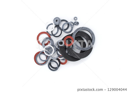Variety of circular rubber gaskets, presented in different sizes and colors on white. Variety of circular rubber gaskets, presented in different sizes and colors on white. 129004044