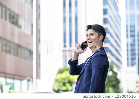 A man calling on a smartphone 129004530