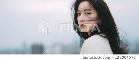 A portrait of a neat and pretty woman 129004578