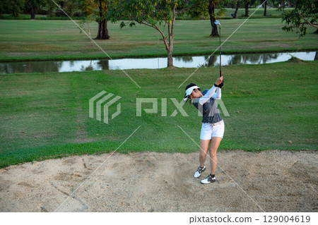 Golfer sport course golf ball fairway. People lifestyle woman playing game golf Golfer sport course golf ball fairway. People lifestyle woman playing game golf 129004619