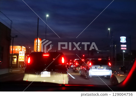 Night intersection, view from the driver's seat during traffic jam 129004756