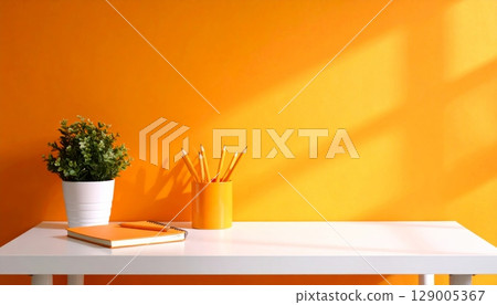 Bottle of perfume and flowers in a vase on a wooden table in an indoor room with natural window light Bottle of perfume and flowers in a vase on a wooden table in an indoor room with natural window light 129005367