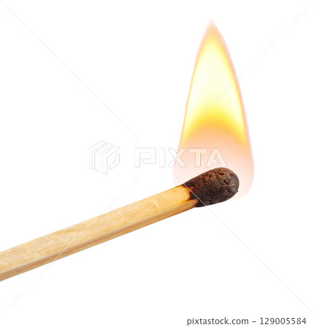A macro shot captures a bright red and orange flame on a wooden matchstick burning against a clean black background 129005584