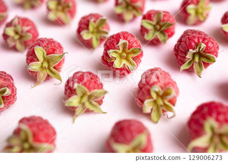 Fresh ripe raspberry with leaf on pink background, Summer fruit 129006273