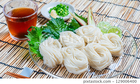 A refreshing summer dish of hand-pulled somen noodles served with condiments A refreshing summer dish of hand-pulled somen noodles served with condiments 129006400