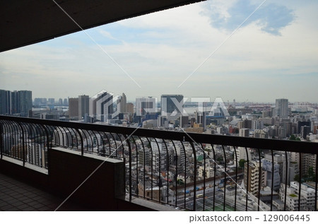 Aerial Cityscape of Tokyo Waterfront from Shinagawa with Skyscrapers, Container Cranes, and Blue Summer Sky, Looking Toward Odaiba and Haneda Area Aerial Cityscape of Tokyo Waterfront from Shinagawa with Skyscrapers, Container Cranes, and Blue Summer Sky, Looking Toward Odaiba and Haneda Area 129006445