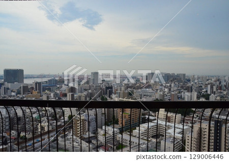 Aerial Cityscape of Tokyo Waterfront from Shinagawa with Skyscrapers, Container Cranes, and Blue Summer Sky, Looking Toward Odaiba and Haneda Area 129006446