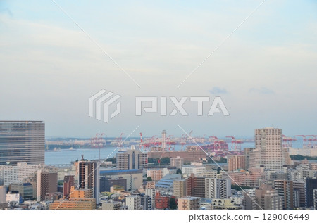 Aerial Cityscape of Tokyo Waterfront from Shinagawa with Skyscrapers, Container Cranes, and Blue Summer Sky, Looking Toward Odaiba and Haneda Area Aerial Cityscape of Tokyo Waterfront from Shinagawa with Skyscrapers, Container Cranes, and Blue Summer Sky, Looking Toward Odaiba and Haneda Area 129006449