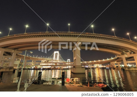 Illuminated Rainbow Bridge - Night view of the bay area Illuminated Rainbow Bridge - Night view of the bay area 129006805
