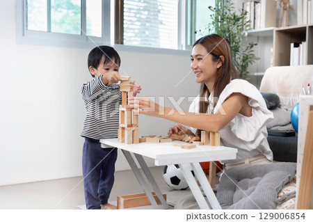 Building blocks: mother and child creating together 129006854