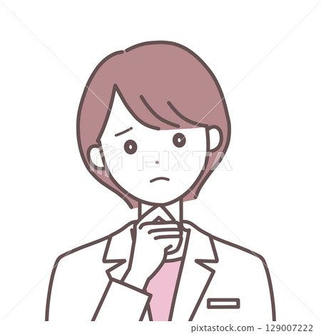 A woman in a white coat with a troubled expression 129007222