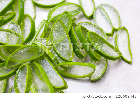 Sliced aloe vera pieces with translucent gel Sliced aloe vera pieces with translucent gel 129008443