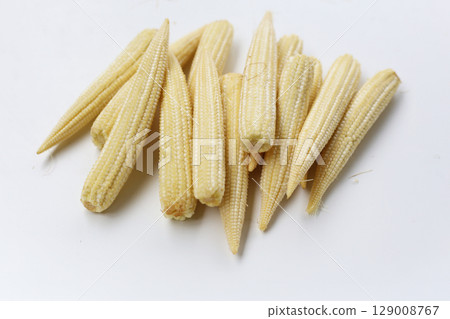 Fresh baby corn on white background. 129008767