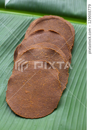 Fermented soybean discs, Thai seasoning used to enhance flavor in Northern cuisine. 129008779