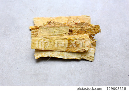 Dried slices of Radix Astragali, commonly used in traditional Chinese medicine. Dried slices of Radix Astragali, commonly used in traditional Chinese medicine. 129008836