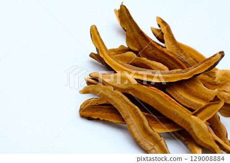Dried slices of Ganoderma lucidum, also known as reishi mushroom, widely used in traditional medicine for its immune-boosting properties. Dried slices of Ganoderma lucidum, also known as reishi mushroom, widely used in traditional medicine for its immune-boosting properties. 129008884