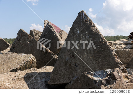Close-Up Shot of Geometric Concrete Shapes Against Blue Sky Close-Up Shot of Geometric Concrete Shapes Against Blue Sky 129009038