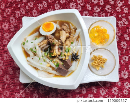 Authentic Thai Kuay Jab with Chicken Feet and Egg on Red Fabric Authentic Thai Kuay Jab with Chicken Feet and Egg on Red Fabric 129009837