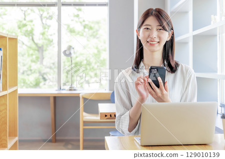 Young female cafe smartphone coworking share office Young female cafe smartphone coworking share office 129010139