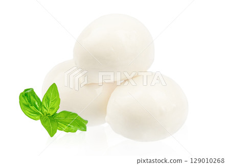 Fresh mozzarella cheese balls with basil leaves isolated on a white background, perfect for Italian dishes Fresh mozzarella cheese balls with basil leaves isolated on a white background, perfect for Italian dishes 129010268