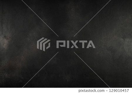 Dark black textured background, perfect for food photography, cooking blogs, or culinary designs Dark black textured background, perfect for food photography, cooking blogs, or culinary designs 129010457