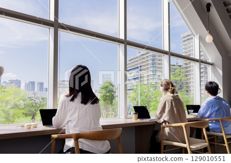 Designer's office, fresh greenery, buildings, blue sky, windows Designer's office, fresh greenery, buildings, blue sky, windows 129010551