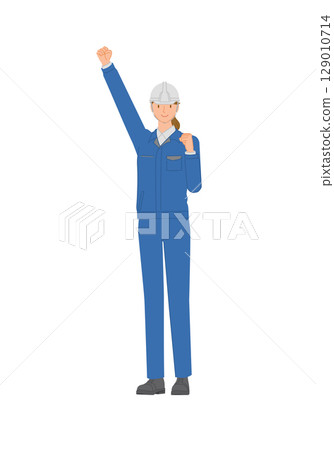 Business image: Smiling young woman wearing work clothes and a helmet: raising her arms in a fist pump Business image: Smiling young woman wearing work clothes and a helmet: raising her arms in a fist pump 129010714
