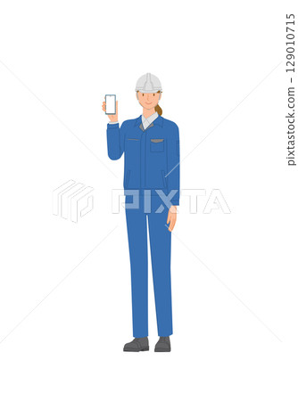 Business image: Smiling young woman wearing work clothes and a helmet: holding a smartphone Business image: Smiling young woman wearing work clothes and a helmet: holding a smartphone 129010715