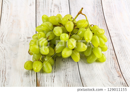 Green juicy sweet ripe Grape bunch 129011155