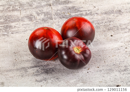 Black ripe juicy organic tomato Black ripe juicy organic tomato 129011156