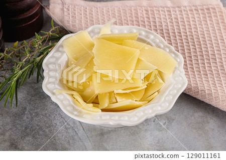 Parmesan cheese slices in the bowl Parmesan cheese slices in the bowl 129011161