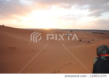 Sand dunes in the Sahara Desert at amazing sunrise, Orange dunes in the desert of Morocco Sand dunes in the Sahara Desert at amazing sunrise, Orange dunes in the desert of Morocco 129011370