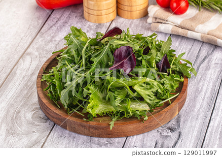 Fresh green ruccola salad leaves 129011997