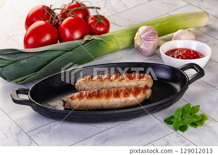 Grilled pork sausages served tomato sauce 129012013