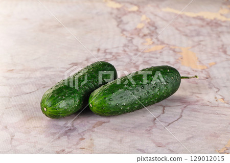 Ripe green raw two cucumbers 129012015