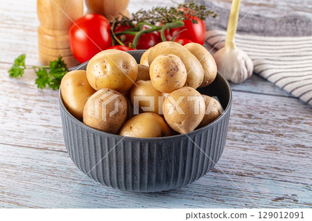 Uncooked raw yellow baby potato 129012091