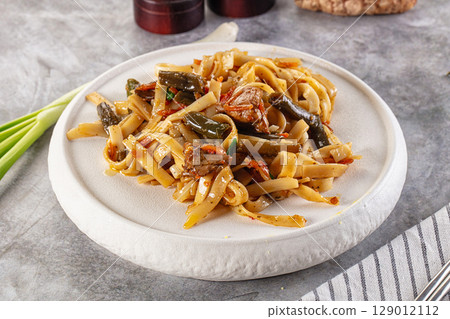 Asian cuisine udon with chicken and vegetables Asian cuisine udon with chicken and vegetables 129012112