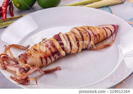 Tasty grilled wild squid with lime 129012164