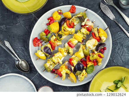Fish skewers with vegetables for a delicious barbecue. Fish skewers with vegetables for a delicious barbecue. 129012624