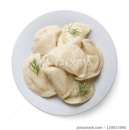 Boiled dumplings in a plate on a white background. Top view Boiled dumplings in a plate on a white background. Top view 129015998