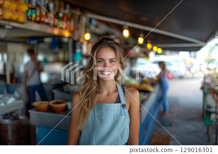 Happy Food Vendor In Apron At A Bustling Market Stall Happy Food Vendor In Apron At A Bustling Market Stall 129016301